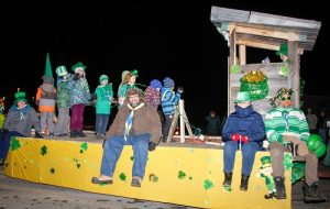 Members of the Cobden Scout Pack waved to the crowd as they travelled along on their float.
