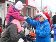 Crowds cheer on participants in the Cobden Santa Claus Parade