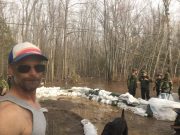 Sandbagging since Easter, protecting his home