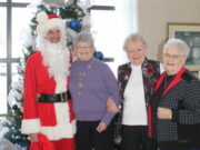 Local dresses as Santa Claus, visits Caressant Care