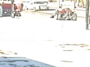 Truck drives through gate of farm equipment business